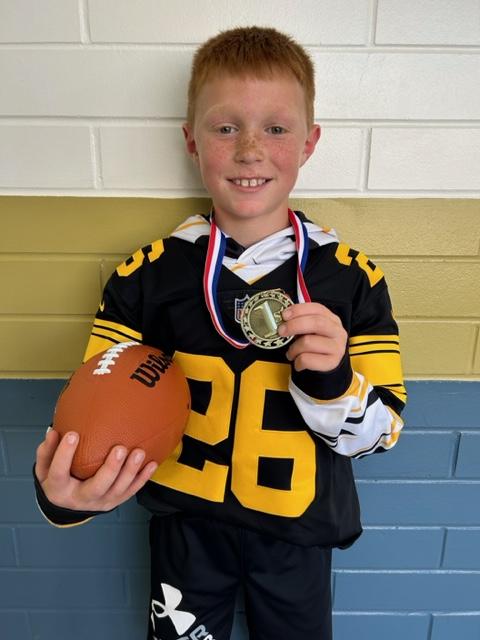 pic of boy in a Steeler jersey